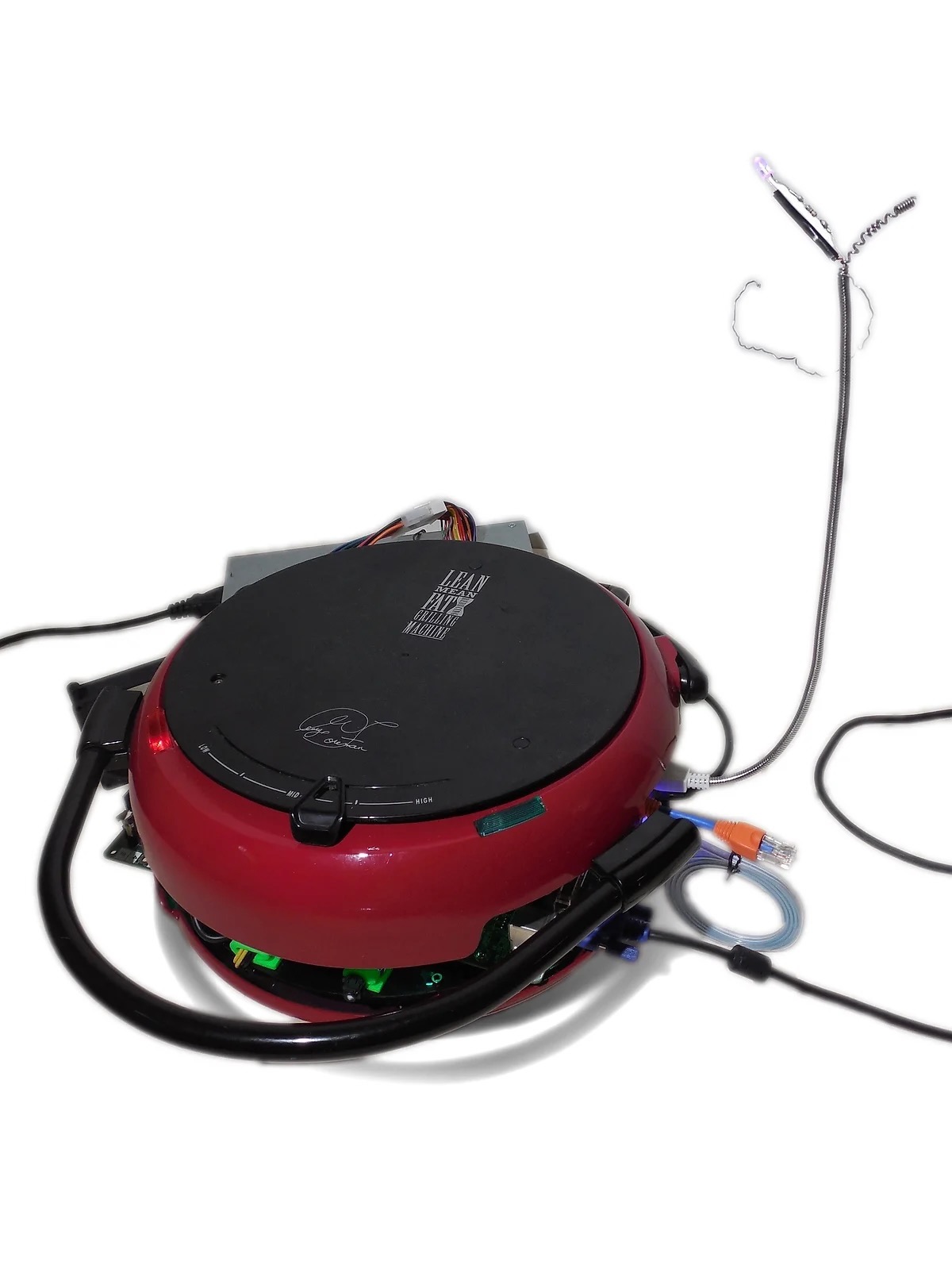 Lean Mean Computing Machine: a George Foreman Computer with the lid closed, built by artist Doug MacDowell and 
  featured in do not research. George Foreman grill art.