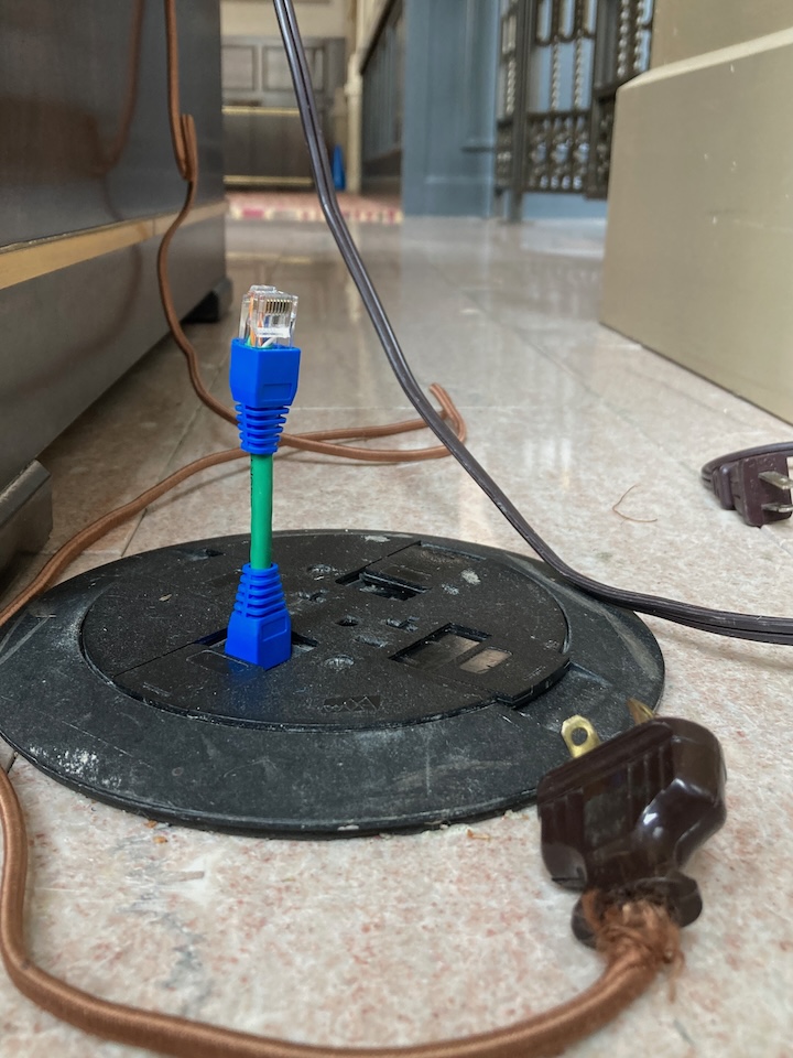 Petite UTP Convertible Cables in action on the floor — compact 4.25-inch Ethernet cables by Doug MacDowell